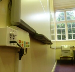 low view of smart board and teachers AV plate