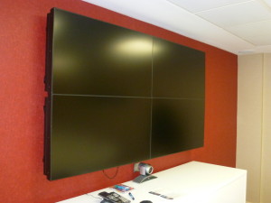 huge screen with red wall background