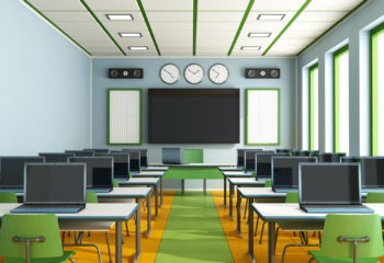 Multimedia classroom with computers, screen and speakers