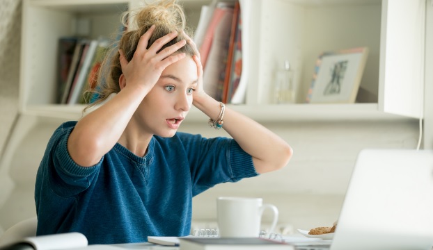 female looking problematic in front of a laptop