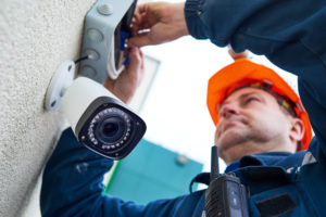 An electrician installing a CCTV