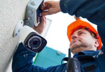 An electrician installing a CCTV